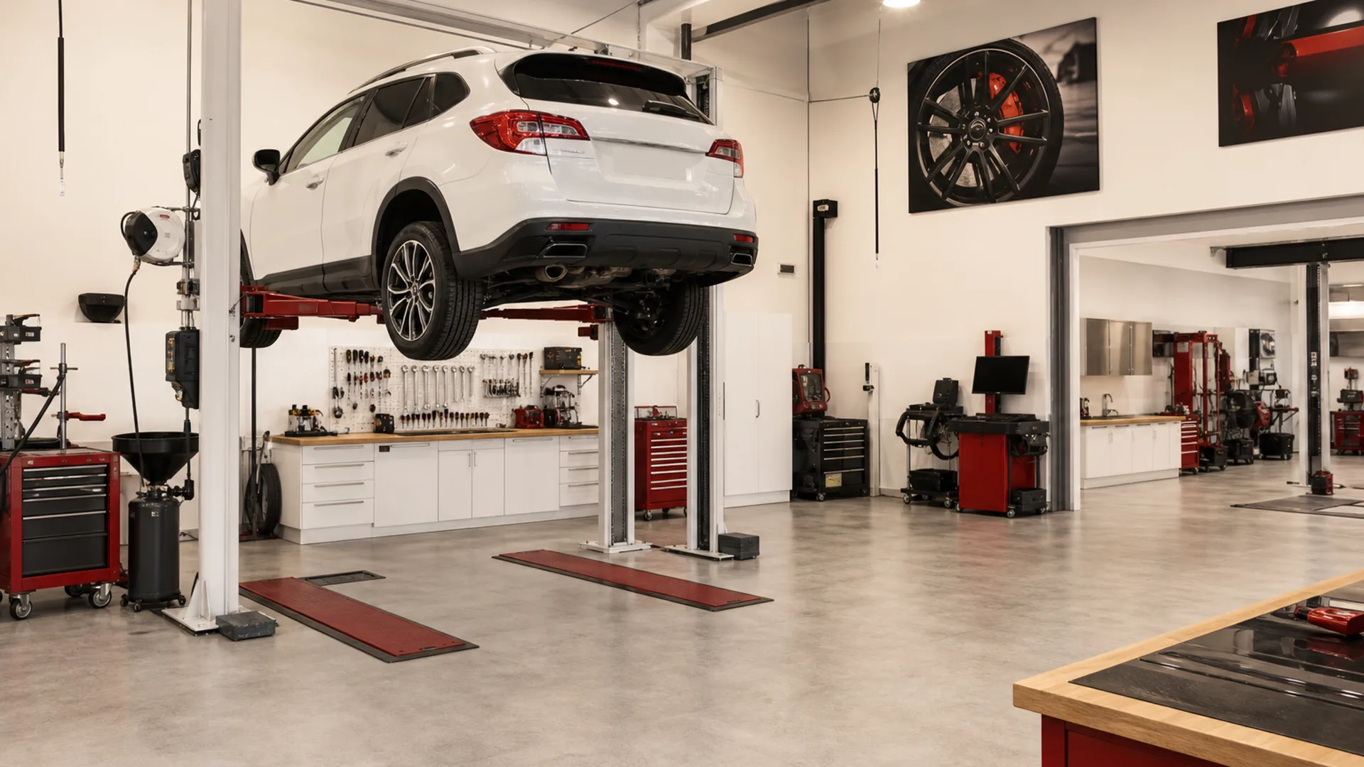Professional automotive workshop with lift bays and diagnostic equipment, 1920x1080